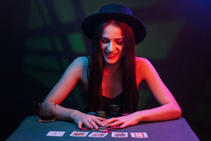 Live baccarat dealer dealing cards in a professional studio